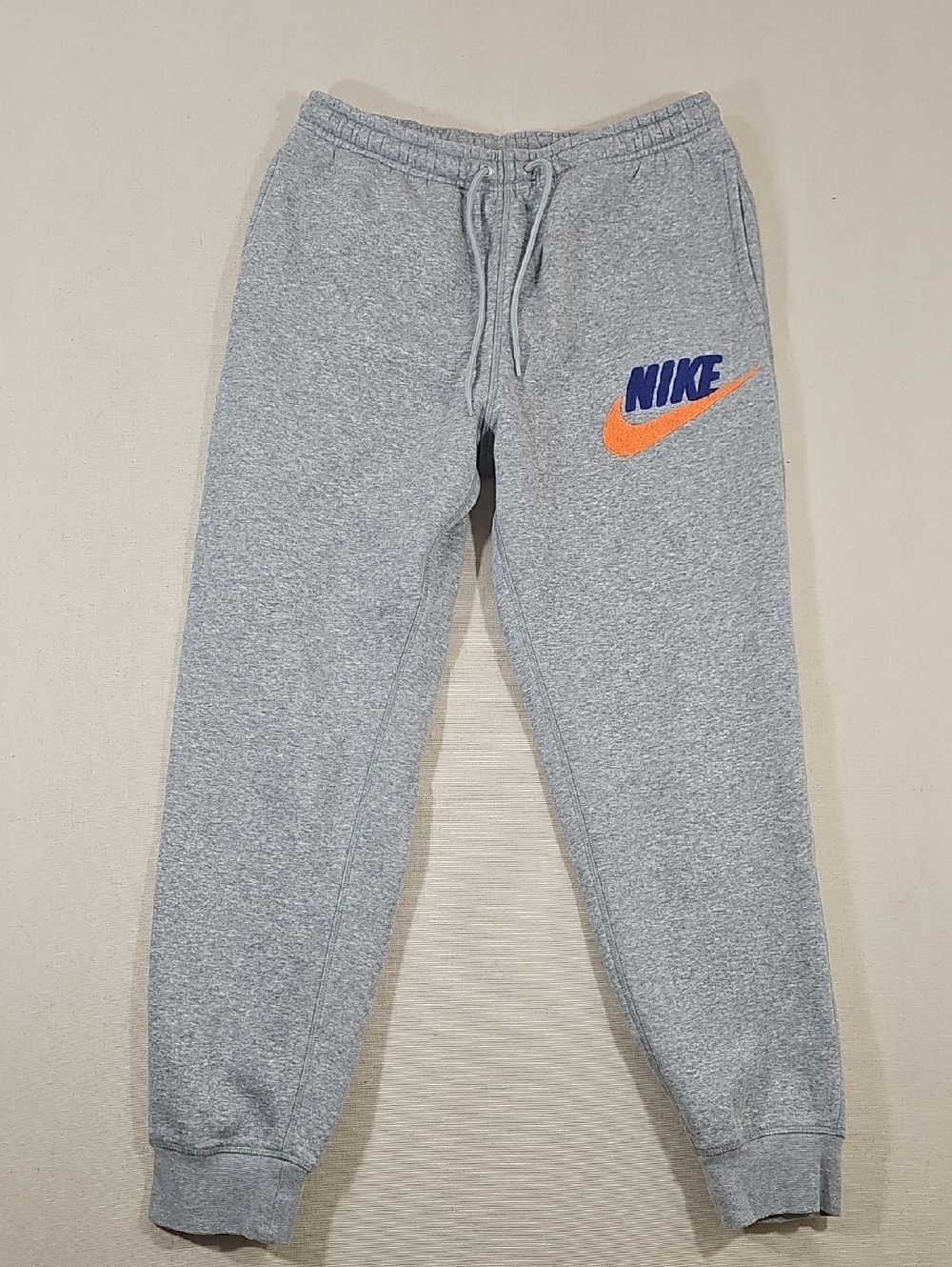 Nike Grey Joggers with Blue NIKE and Orange Swoosh